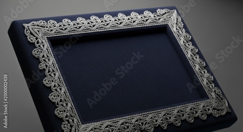 Ornate silver frame on black.