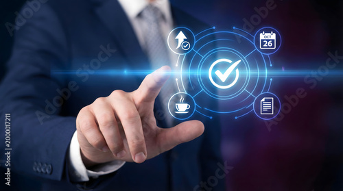 Businessman interacting with futuristic interface icons for task management and organization