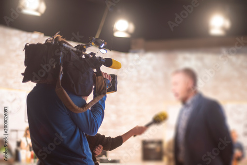 Billede på lærred TV Operator Recording Business Interview in Professional Studio with Copy Space