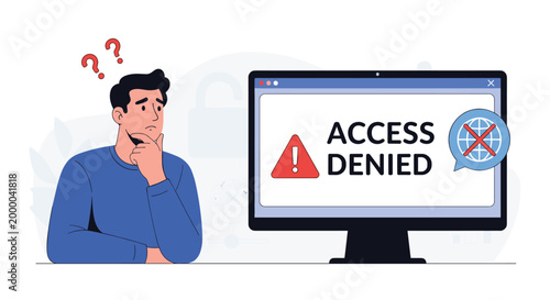 Confused young man looks at his computer screen displaying an access denied message with a red warning triangle icon.