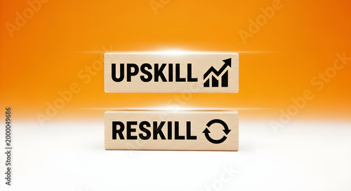 Two wooden blocks with upskill and reskill words on an orange background for career development