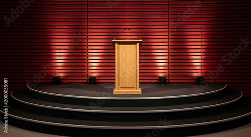 Empty wooden podium on a dark, multi-tiered circular stage illuminated by dramatic red spotlights against a slatted red background.