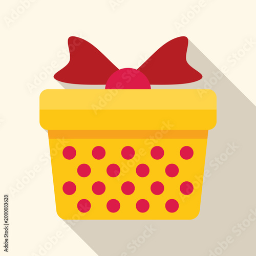 Yellow gift box featuring red polka dots and a red bow, creating a festive holiday celebration symbol