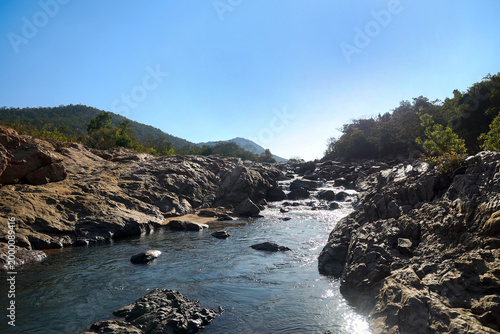 Bild auf Leinwand Dark Natural River Landscape with Blue Sky Copy Space for Banner Background and