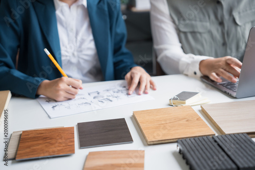 Canvas Print Interior designers brainstorming creative design ideas for modern home in collab