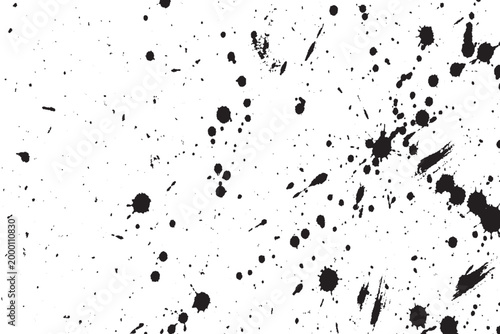 Abstract black ink splatters and spots texture on a white background