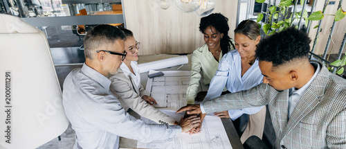 Happy team displays achievement with active collaboration and pride