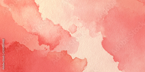 Soft pink watercolor background with blended peach and coral hues for design and artistic projects