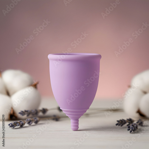 Minimal purple menstrual cup with soft background eco friendly hygiene product