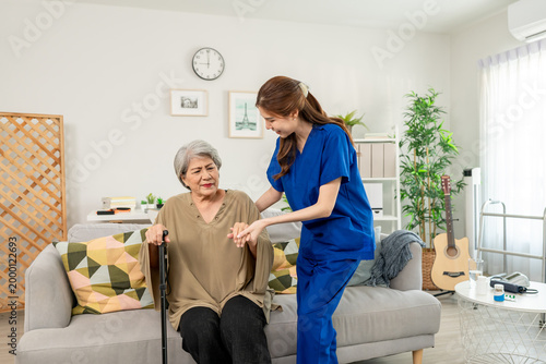 Asian caring caregiver look after senior woman patient at nursing home. 