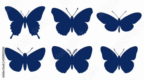 Set of various dark blue butterfly silhouettes on white background