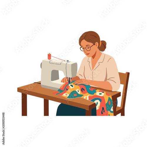 A woman sitting at a table operates a sewing machine with colorful fabric.