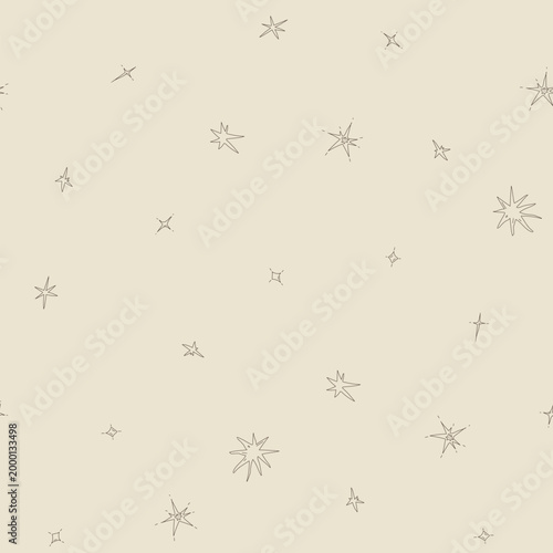 Hand drawn stars forming a seamless celestial pattern, offering a whimsical and magical backdrop, ideal for fabric prints, packaging, and digital designs celebrating wonder and astronomy