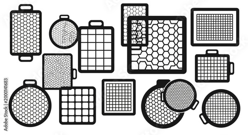 Collection of various grid and honeycomb light modifiers for photography and videography isolated on white background studio lighting equipment accessories professional creative