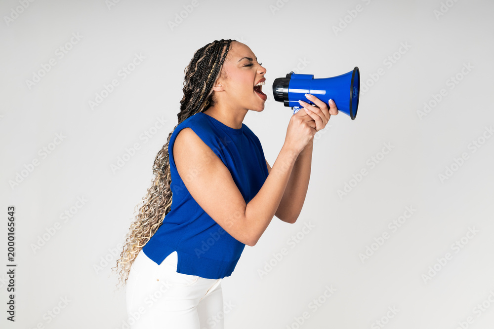 © VISTA by Westend61 - Activist shouting into a blue megaphone against white background © VISTA by Westend61 - Activist shouting into a blue megaphone against white background