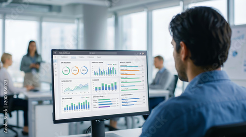 Professional businessman analyzing success growth goal target kpi achievement strategy on digital dashboard screen in modern office environment for corporate performance and data analytics report.