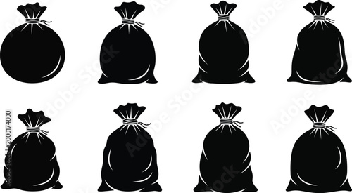 Eight black trash bags isolated on a white background depicting waste disposal and sanitation concepts
