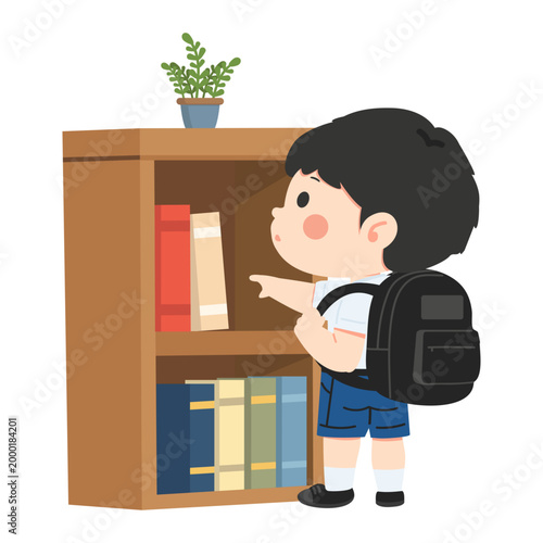 Boy Reaching For Book On Shelf In Library