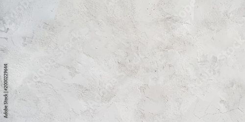 Vintage white marble and old paper textures blend with a grunge plaster wall pattern to create a weathered gray stone surface design for blank material backgrounds