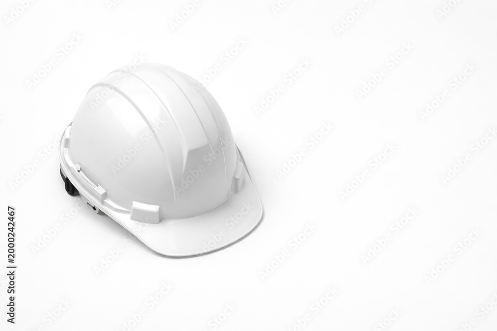 Fototapeta premium Flatly arranged white construction headgear surrounded by copy space