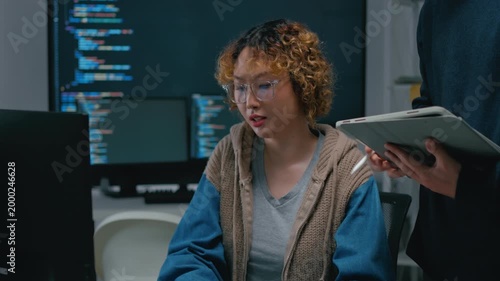 Adult male,asian female freelance typing write prompt AI bot IT app smart program,develop agentic ai,terminal with coding language,ux ui interface,designer,big data server center,quantum computer.