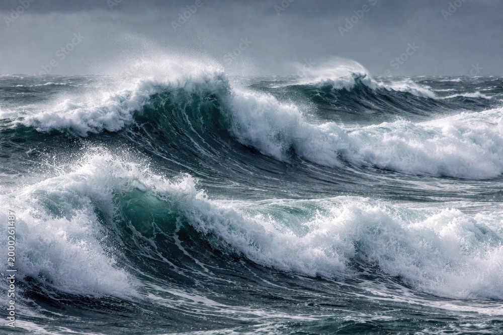 Fototapeta premium Energetic ocean waves with whitecaps in strong winds