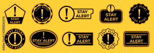 Warning sign collection set. Stay alert labels with exclamation mark symbols in safety style. Flat vector design