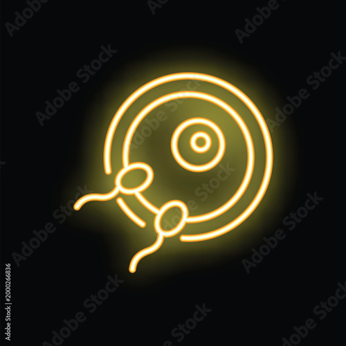 Yellow glowing neon style icon of sperm fertilizing egg cell ovum representing human fertilization process
