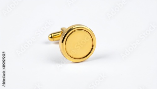Elegant Gold Cufflink on White Background for Formal Attire.