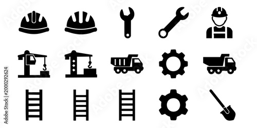 Construction workers operate heavy machinery and equipment on an industrial site
