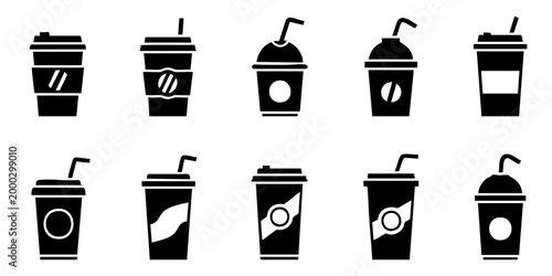 Various disposable cups with straws are arranged on a surface