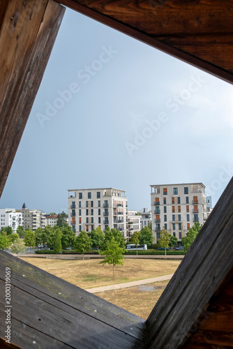 Residential apartments cityscape in Frankfurt near Europagarten Germany with urban park framing and sustainable development creating a calm modern district view