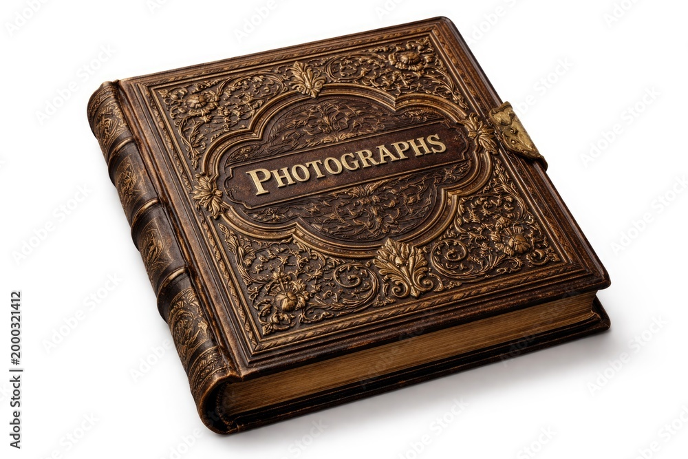 Fototapeta premium Old fashioned photo album cover with intricate embossing isolated against white