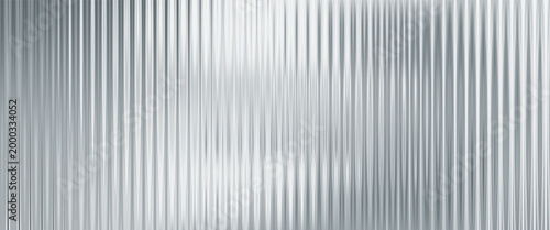Silver acrylic ribbed glass texture background with fluted plastic panel and soft blurred light reflections. Abstract surface with subtle gradients for modern minimal design.