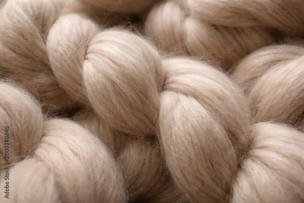 Fototapeta premium Beige smoky merino wool yarn fibers shown in detailed close-up for blanket making