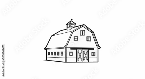 A classic gambrel roof barn with double doors and multiple windows