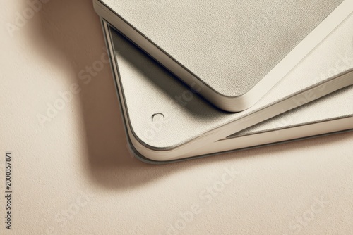 Stacked neutral hued tablets on soft background for modern technology presentation