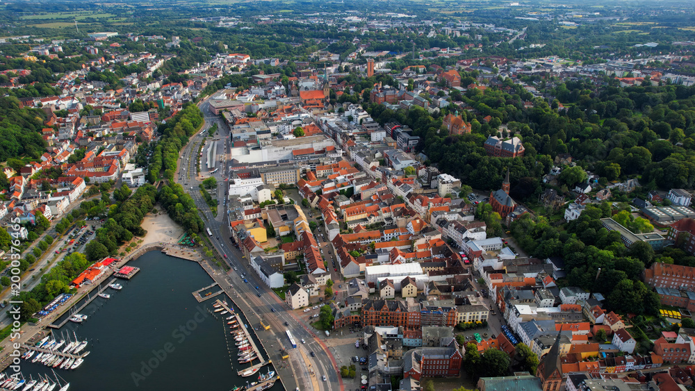 Obraz premium Aerial view around the old town of the city Flensburg in Germany on a sunny spring noon