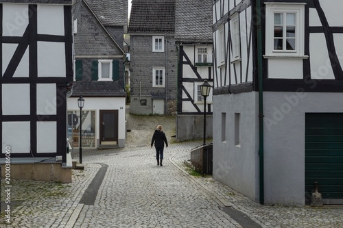 Fotografie The historic centre with half timbered houses of Friedensdorf Germany, a village in the municipality of Saerbeck, district Steinfurt, the state of North Rhine-Westphalia