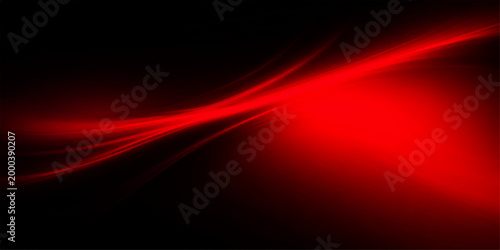 A bold artistic depiction of light in vibrant shades of red against a deep black background, creating an image.