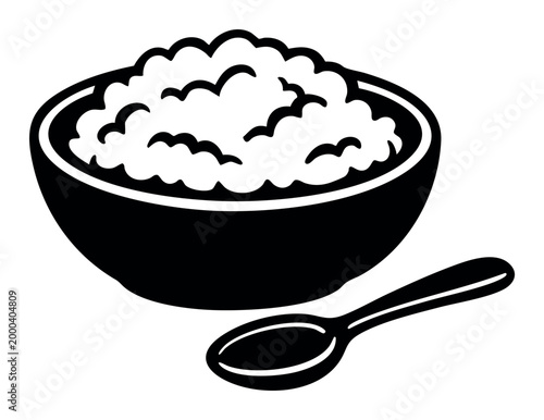 Bowl of warm oatmeal with a spoon beside it, symbolizing a nutritious breakfast and a cozy meal option