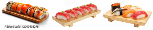 Fotografie Assortment of fresh Japanese sushi and sashimi, including maki rolls, tuna nigiri, salmon nigiri, eel nigiri, shrimp nigiri, and salmon roe gunkan maki, served on wooden boards