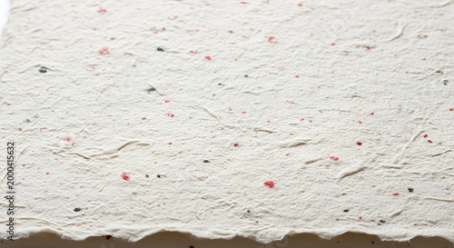 Textured Handmade Paper with Flecks of Color.