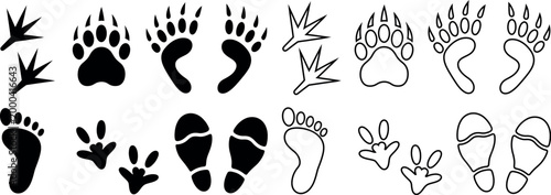 Collection of various animal and human footprints and paw prints silhouettes isolated on a white background