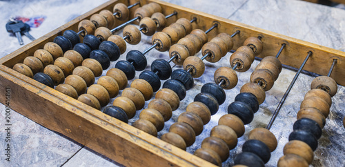 Tableau sur toile Traditional wooden abacus with black and brown beads