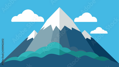 Snow covered mountain peak with blue sky and clouds