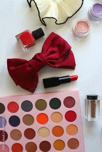 Various accessories and beauty products on white background. Coquette aesthetic. Flat lay.