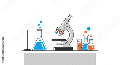 Microscope and laboratory glassware with colorful liquids and bubbles on a table