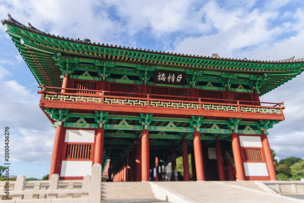 Fototapeta premium Woljeonggyo Bridge, Gyeongju, South Korea, in a autumn fall day with a blue sky, covered bridge, Silla Dynasty Pavilion, North Gyeongsang Province, Silla dinasty traditional Korean architecture