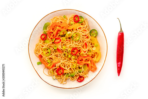 Hakka noodles with vegetables, peppers and green onions, overhead shot